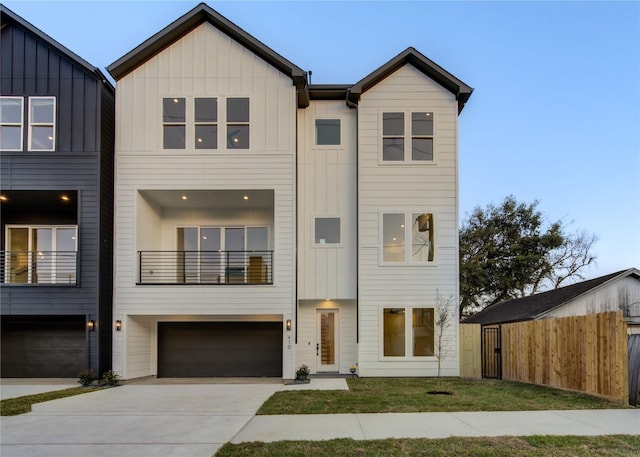 410 N Nagle St, Houston, TX 77003 - view of property featuring board and batten siding, a garage, and concrete driveway