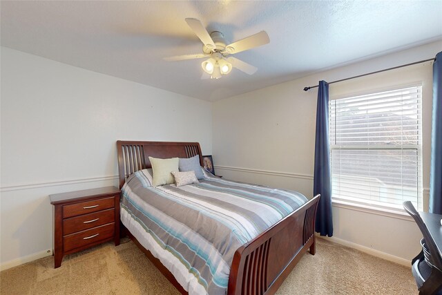 21419 Hannover Estates Dr, Spring, TX 77388 - bedroom featuring light carpet and a ceiling fan