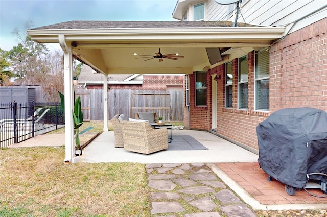 21419 Hannover Estates Dr, Spring, TX 77388 - fenced backyard featuring ceiling fan, grilling area, a patio, and an outdoor hangout area