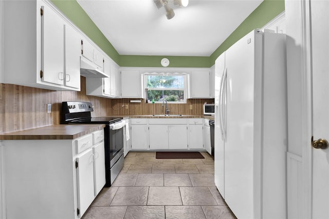 1011 Fairway Farms Ln, Houston, TX 77339 - kitchen with white appliances, under cabinet range hood, white cabinets, and tasteful backsplash