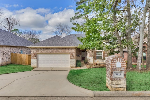 3816 Mystic Cir, Montgomery, TX 77356 - view of front of property featuring roof with shingles, brick siding, driveway, an attached garage, and a chimney