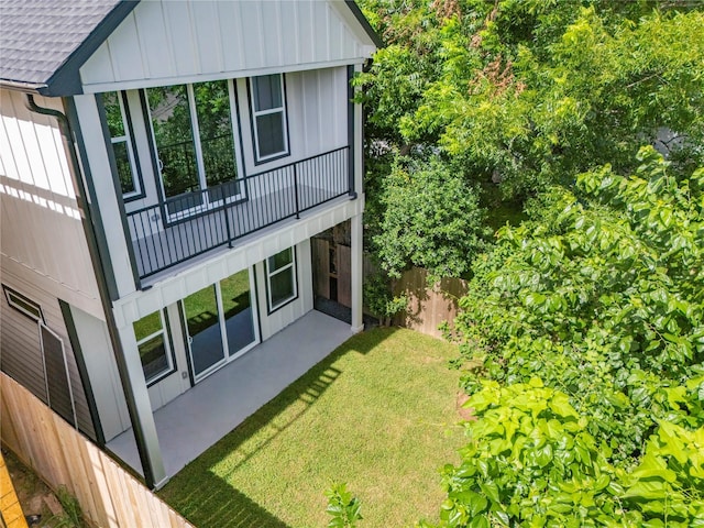 412 E 34th St, Houston, TX 77018 - back of house featuring board and batten siding, a shingled roof, and a balcony