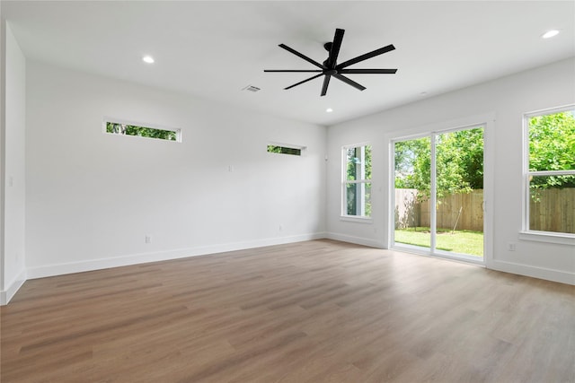 412 E 34th St, Houston, TX 77018 - empty room featuring ceiling fan, wood finished floors, and recessed lighting