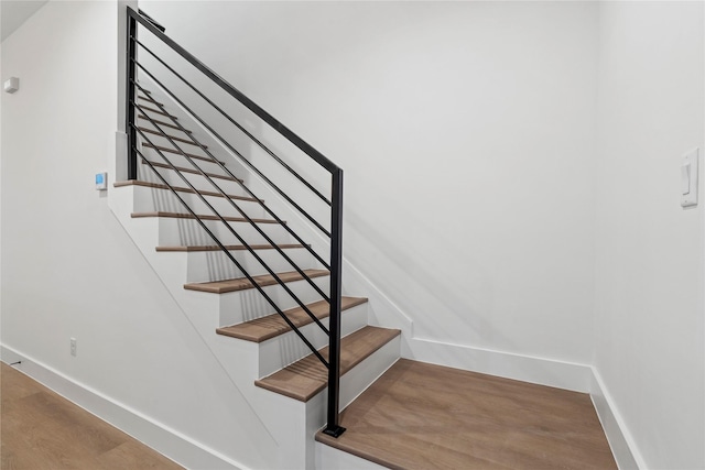 412 E 34th St, Houston, TX 77018 - staircase featuring baseboards