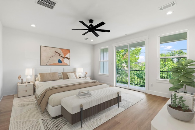 412 E 34th St, Houston, TX 77018 - bedroom with access to outside, wood finished floors, recessed lighting, and a ceiling fan