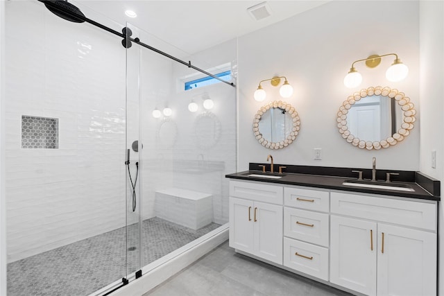 412 E 34th St, Houston, TX 77018 - bathroom with a shower stall, double vanity, and tile patterned flooring