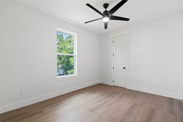 412 E 34th St, Houston, TX 77018 - spare room featuring wood finished floors and a ceiling fan