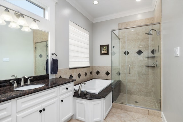 983 W 42nd St, Houston, TX 77018 - bathroom with a garden tub, vanity, tile patterned flooring, a shower stall, and ornamental molding