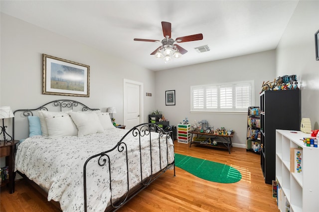 983 W 42nd St, Houston, TX 77018 - bedroom featuring wood finished floors and ceiling fan