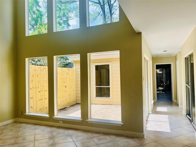 11530 Bellerive Dr, Houston, TX 77072 - doorway to outside featuring tile patterned flooring and a towering ceiling