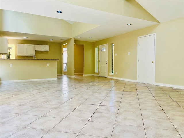 11530 Bellerive Dr, Houston, TX 77072 - unfurnished living room with light tile patterned flooring, recessed lighting, and vaulted ceiling