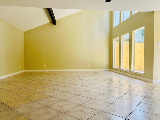 11530 Bellerive Dr, Houston, TX 77072 - unfurnished living room with light tile patterned floors, high vaulted ceiling, and beam ceiling