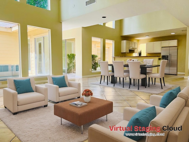11530 Bellerive Dr, Houston, TX 77072 - living area featuring a high ceiling, healthy amount of natural light, and light tile patterned flooring