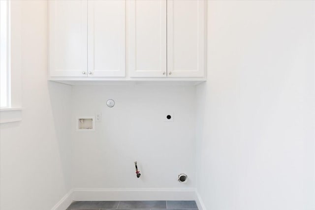 6723 Saint Augustine St, Houston, TX 77021 - laundry area featuring gas dryer hookup, electric dryer hookup, hookup for a washing machine, and cabinet space
