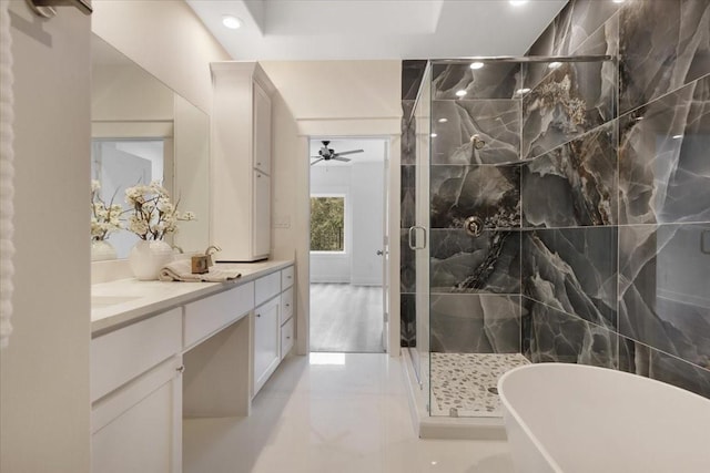6723 Saint Augustine St, Houston, TX 77021 - full bath with double vanity, a freestanding tub, a stall shower, a ceiling fan, and recessed lighting