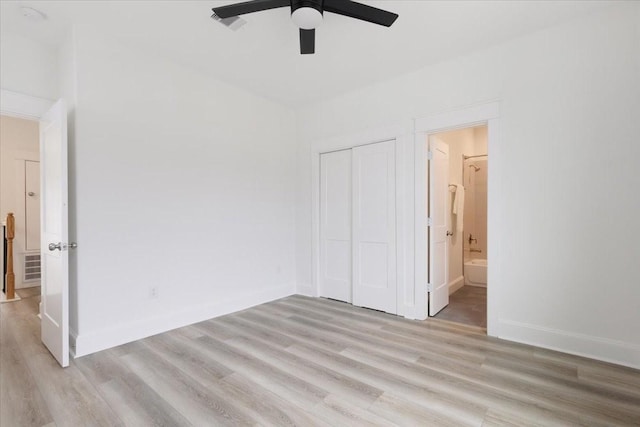 6723 Saint Augustine St, Houston, TX 77021 - unfurnished bedroom featuring light wood finished floors, a closet, ensuite bath, and ceiling fan