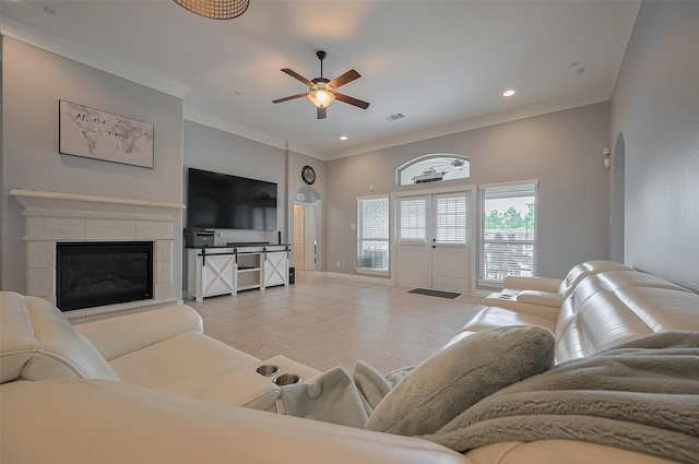 4227 Lodge Ranch Ct, Fulshear, TX 77441 - living area with light tile patterned floors, ceiling fan, ornamental molding, a fireplace, and recessed lighting