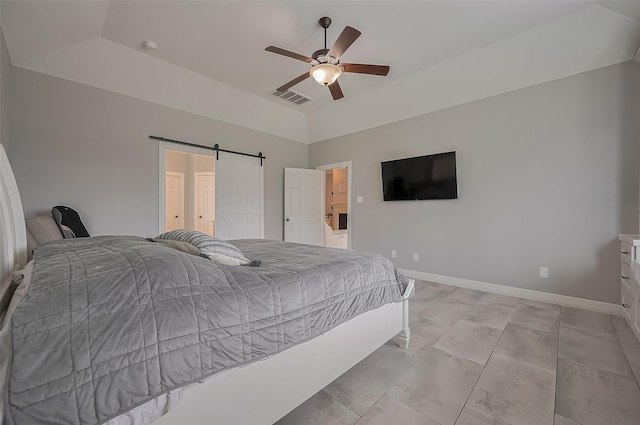 4227 Lodge Ranch Ct, Fulshear, TX 77441 - bedroom featuring a barn door and a ceiling fan