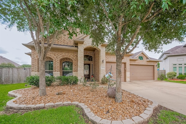 4227 Lodge Ranch Ct, Fulshear, TX 77441 - view of front of home featuring brick siding, concrete driveway, and an attached garage