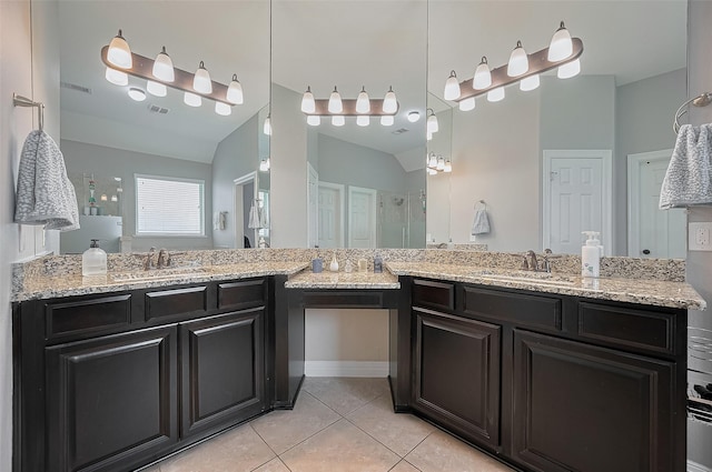 4227 Lodge Ranch Ct, Fulshear, TX 77441 - bathroom with tile patterned floors, double vanity, a shower, and vaulted ceiling
