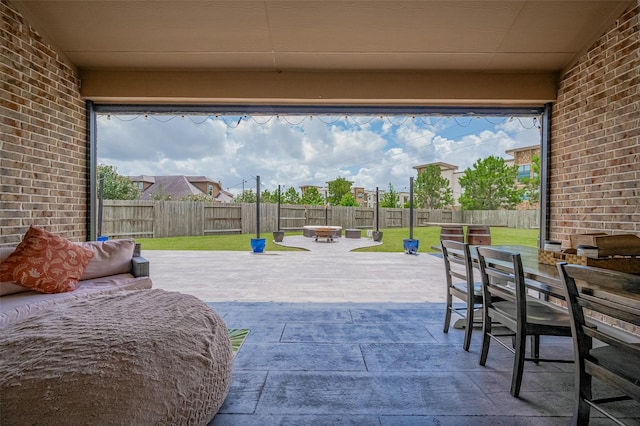 4227 Lodge Ranch Ct, Fulshear, TX 77441 - fenced backyard featuring outdoor dining area, a patio area, and an outdoor fire pit