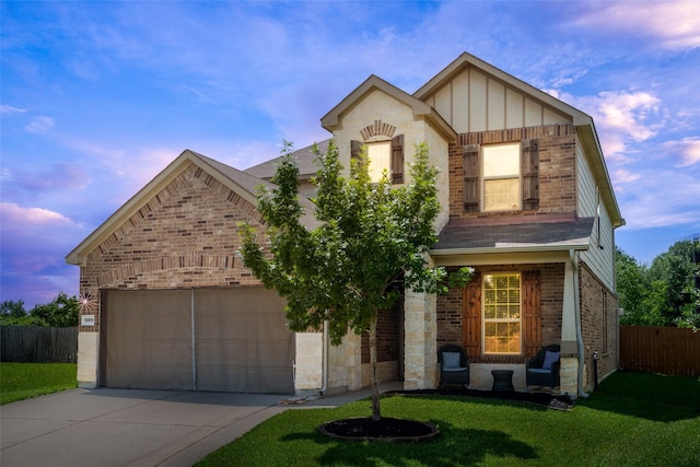 15915 Mountain Willow Way, Cypress, TX 77429 - view of front facade with brick siding, concrete driveway, board and batten siding, roof with shingles, and a garage