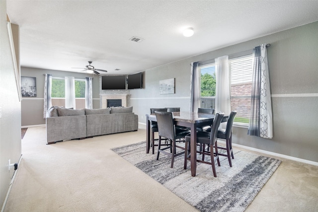 15915 Mountain Willow Way, Cypress, TX 77429 - dining space with carpet, a fireplace, and a ceiling fan