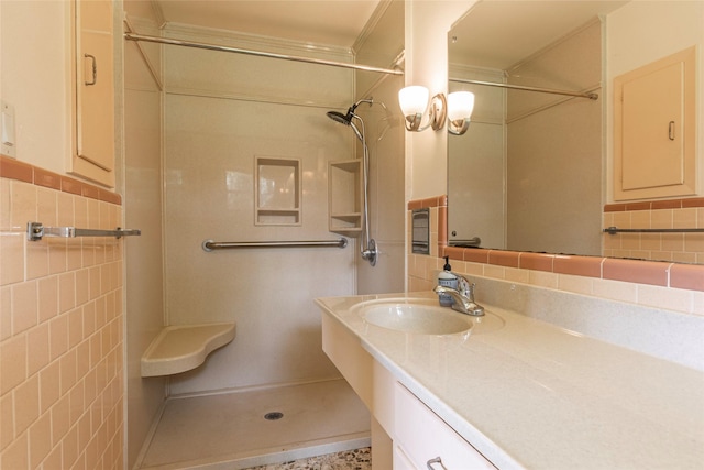 122 Blossom St, Lake Jackson, TX 77566 - full bath with a shower, vanity, tile walls, and ornamental molding