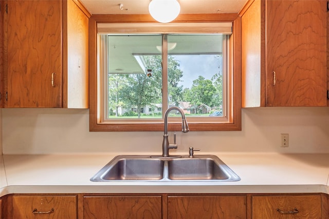 122 Blossom St, Lake Jackson, TX 77566 - kitchen with brown cabinets and light countertops