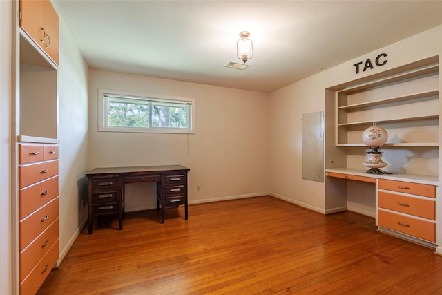 122 Blossom St, Lake Jackson, TX 77566 - unfurnished office featuring light wood-type flooring and built in desk