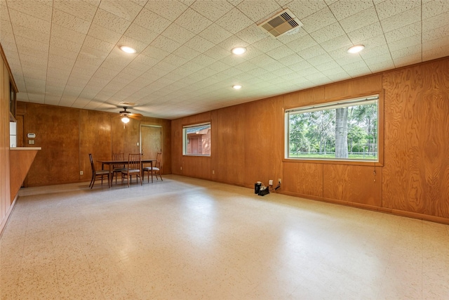 122 Blossom St, Lake Jackson, TX 77566 - empty room with a ceiling fan, wooden walls, and recessed lighting
