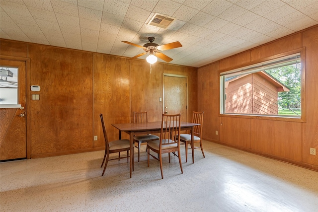 122 Blossom St, Lake Jackson, TX 77566 - dining space with wooden walls and ceiling fan
