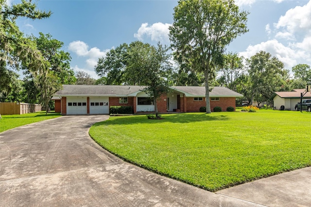 122 Blossom St, Lake Jackson, TX 77566 - single story home featuring driveway, an attached garage, and brick siding