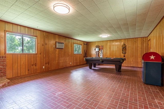 122 Blossom St, Lake Jackson, TX 77566 - recreation room featuring brick patterned floors, pool table, plenty of natural light, and wood walls