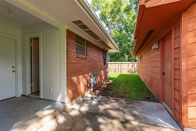 122 Blossom St, Lake Jackson, TX 77566 - view of home's exterior featuring brick siding and a patio area