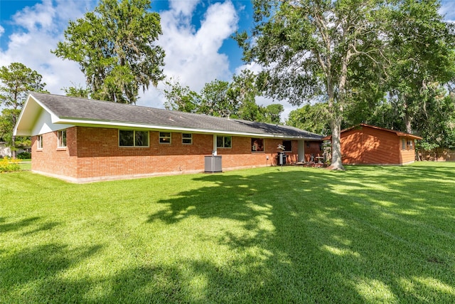122 Blossom St, Lake Jackson, TX 77566 - back of house with a yard and brick siding