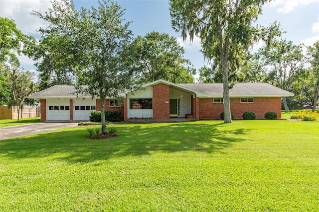 122 Blossom St, Lake Jackson, TX 77566 - view of front of home featuring driveway, an attached garage, and brick siding