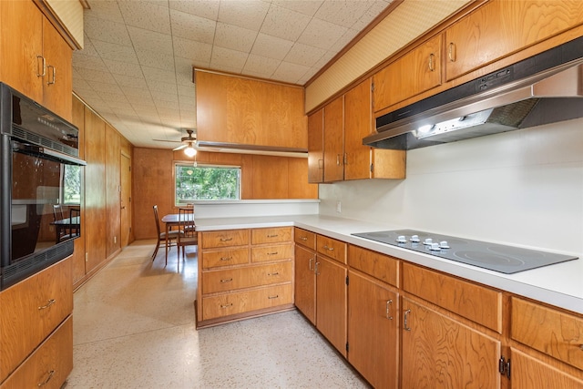 122 Blossom St, Lake Jackson, TX 77566 - kitchen featuring under cabinet range hood, black appliances, brown cabinetry, light countertops, and a ceiling fan