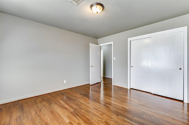 6763 Glen Rock Dr, Houston, TX 77087 - unfurnished bedroom with wood finished floors and a closet