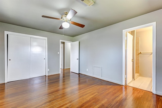 6763 Glen Rock Dr, Houston, TX 77087 - unfurnished bedroom with wood finished floors, a closet, ensuite bathroom, and a ceiling fan