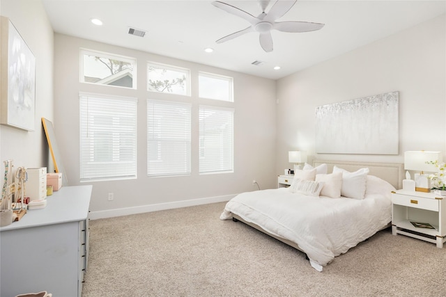 3342 Pinemont Dr, Houston, TX 77018 - bedroom with light carpet, multiple windows, ceiling fan, and recessed lighting