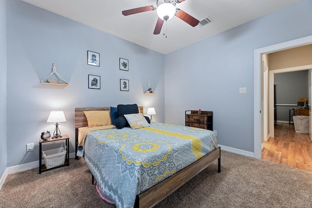 22206 Lantana Dr, Magnolia, TX 77355 - carpeted bedroom with baseboards and a ceiling fan