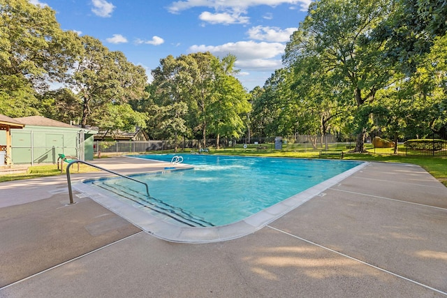 22206 Lantana Dr, Magnolia, TX 77355 - community pool with view of scattered trees and a patio area