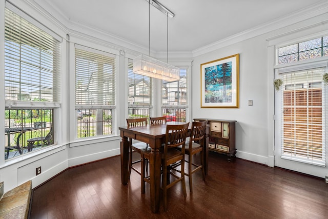 2111 Beall St, Houston, TX 77008 - dining area featuring dark wood-style flooring, plenty of natural light, and crown molding