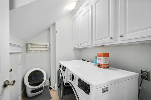 2111 Beall St, Houston, TX 77008 - laundry room featuring independent washer and dryer, cabinet space, and light tile patterned floors
