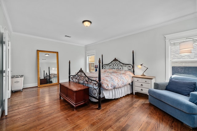 2111 Beall St, Houston, TX 77008 - bedroom featuring multiple windows, crown molding, and dark wood-type flooring