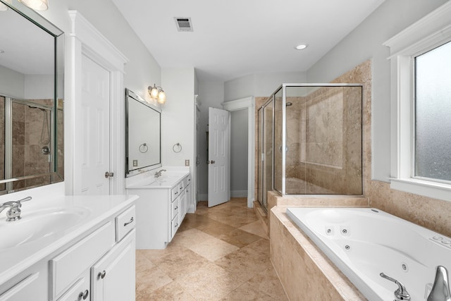 2111 Beall St, Houston, TX 77008 - bathroom with two vanities, a stall shower, and healthy amount of natural light