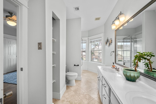 2111 Beall St, Houston, TX 77008 - bathroom with double vanity and toilet