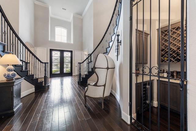 8550 Tombron Grove Rd, Magnolia, TX 77354 - entrance foyer featuring stairs, french doors, a towering ceiling, dark wood-style flooring, and ornamental molding
