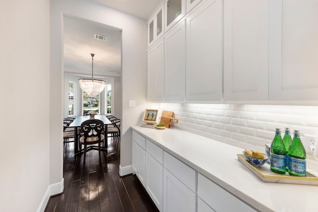 8550 Tombron Grove Rd, Magnolia, TX 77354 - kitchen with light countertops, tasteful backsplash, white cabinets, and glass insert cabinets